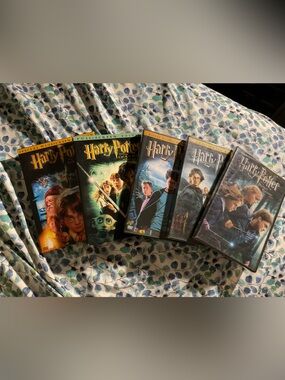 Firm Price New Warner Bros. Harry Potter DVD Movies 1-4 and 7th Movie.